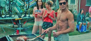 Zac Efron dans le film Nos pires voisins en train de faire un barbecue