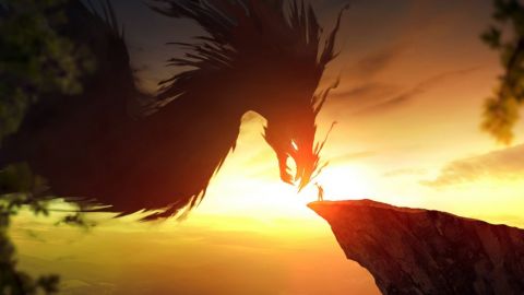 un homme sur un rocher tend la main vers un dragon géant