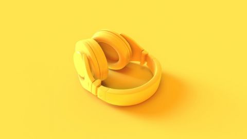 Un casque de musique jaune sur fond jaune
