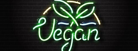 Quels sont les fonds d'investissement véganes ? Un néon vert fluo avec le mot - vegan -