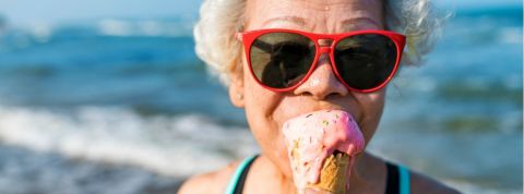 Senior woman eating an ice-cream Senior woman eating an ice-cream