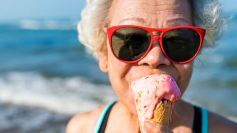 Senior woman eating an ice-cream