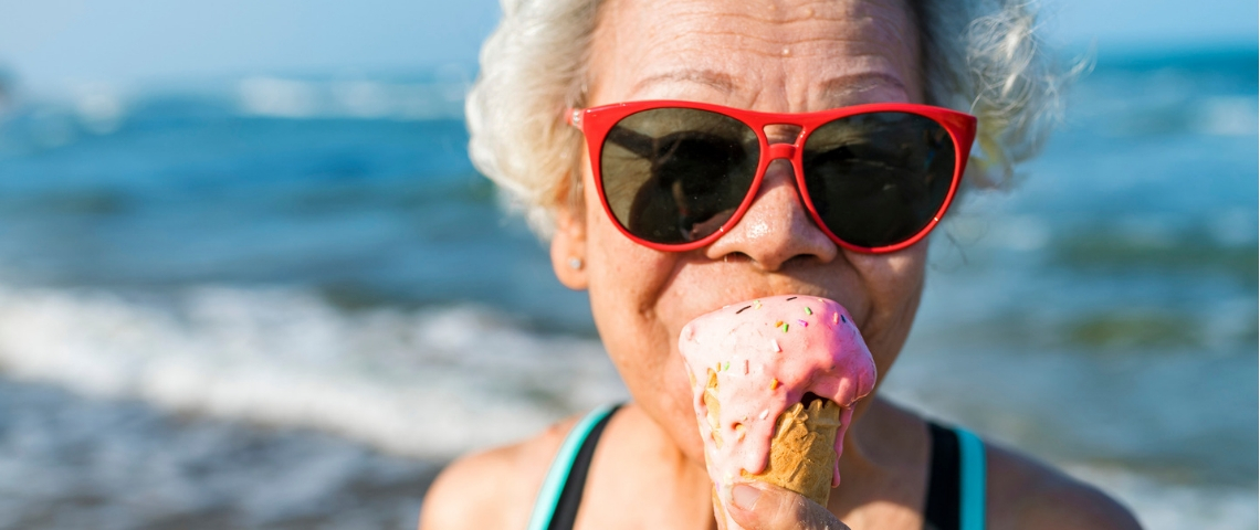 Senior woman eating an ice-cream Senior woman eating an ice-cream