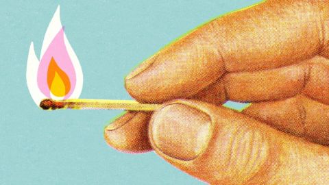 L'illustration d'une main en train de tenir une allumette en feu