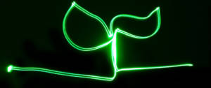 Un signe vert en neon qui représente une feuille