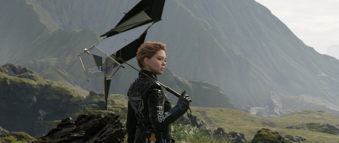 Léa Seydoux dans le jeu Death Stranding une jeune femme en combinaison moulante dans une zone montagneuse.