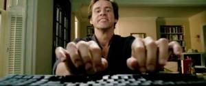 jim carrey tapant sur un clavier