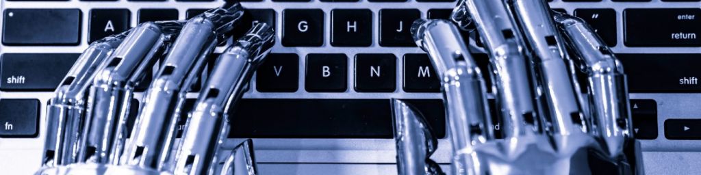 mains robotiques tapent sur un clavier d'ordinateur