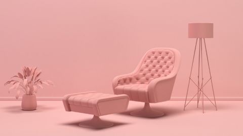 Un salon tout rose avec tous les meubles roses