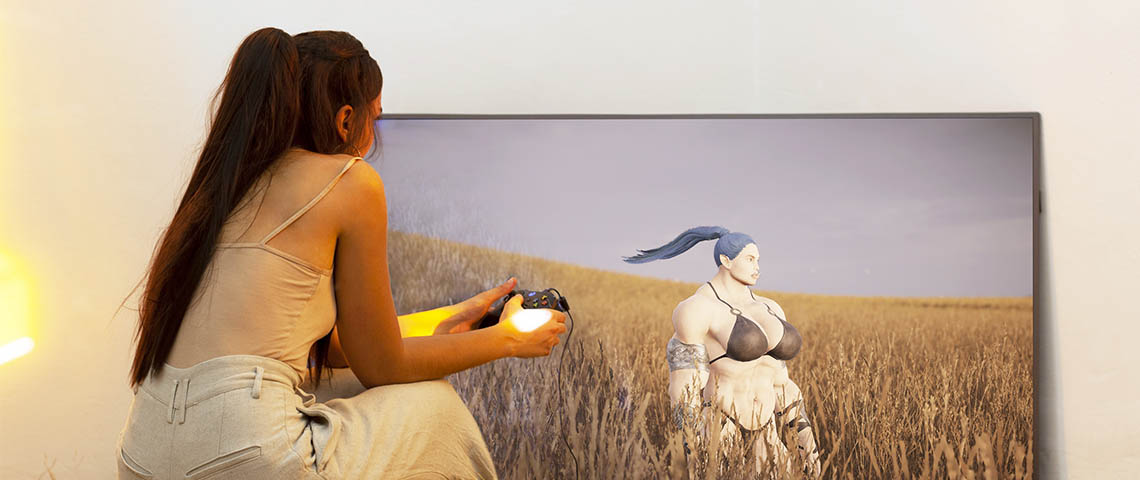Pastoral-Hamouda Fille de dos dans la nature jouant à un jeu vidéo sur une grande TV