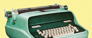 une machine à écrire verte sur fond jaune