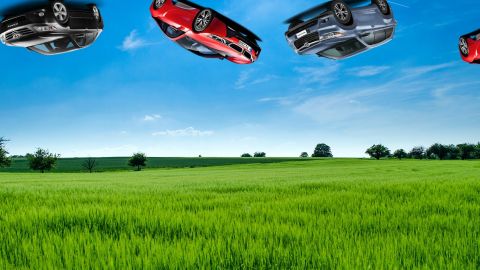 Vue de. campagne et voitures comme balancées dans le ciel