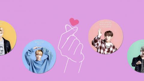 Les membres du groupe BTS sur fond rose