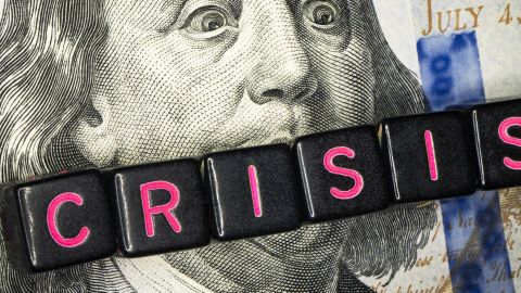 Dollar avec président américian bailloné avec le mot crisis