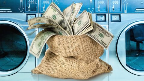 Macines à laver et sac de dollars