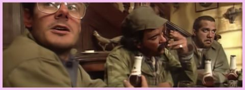 Chasse et alcool Trois chasseurs à table en train de boire