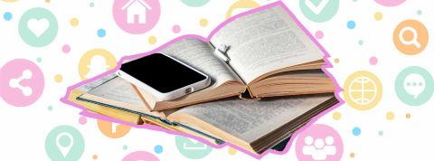Trois livres tech à lire Un smartphone posé sur un livre ouvert