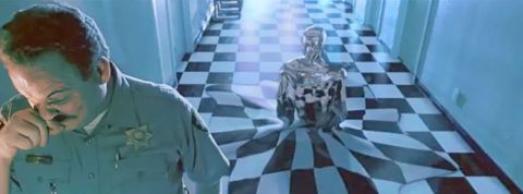 Des scientifiques ont créé un robot capable de traverser les barreaux de sa cellule Au premier blanc un policier et derrière lui un robot qui sort du sol