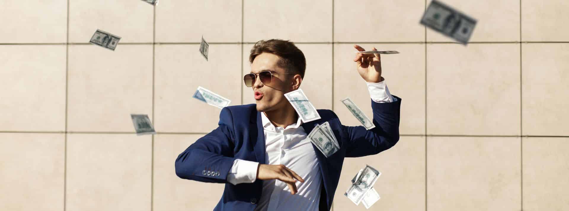 Pour les Générations Z et Y, l’argent fait le bonheur… Mais pas du tout pour les X et les Boomers ! - L'ADN Homme en costume jetant des billets