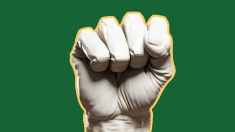Un poing fermé sur fond vert