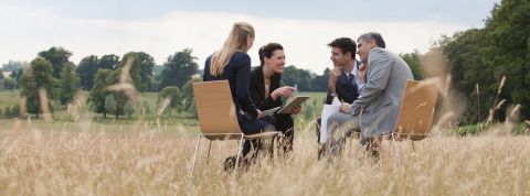 Business people having meeting outdoors Business people having meeting outdoors