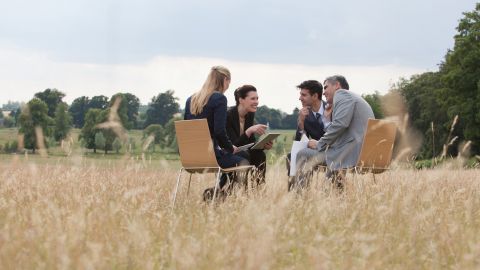 Business people having meeting outdoors