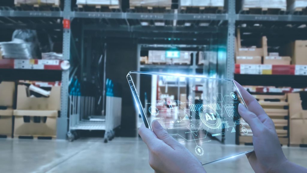 Manager using smart tablet monitor process Analyzes, check and control product in stock warehouse, modern software, futuristic concept smart warehouse management system in Factory industry in