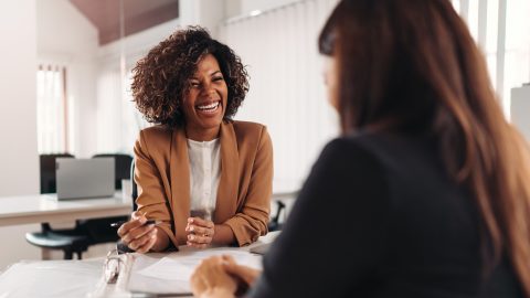 Female financial advisor consulting a client Female financial advisor consulting a client