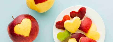 top-view-fruit-heart-shapes-plate-with-knife_1_11zon