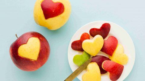 top-view-fruit-heart-shapes-plate-with-knife_1_11zon