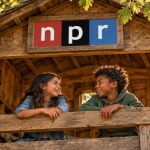 Two kids lean on the railing of a wooden treehouse, smiling at each other, with an NPR sign on the facade.