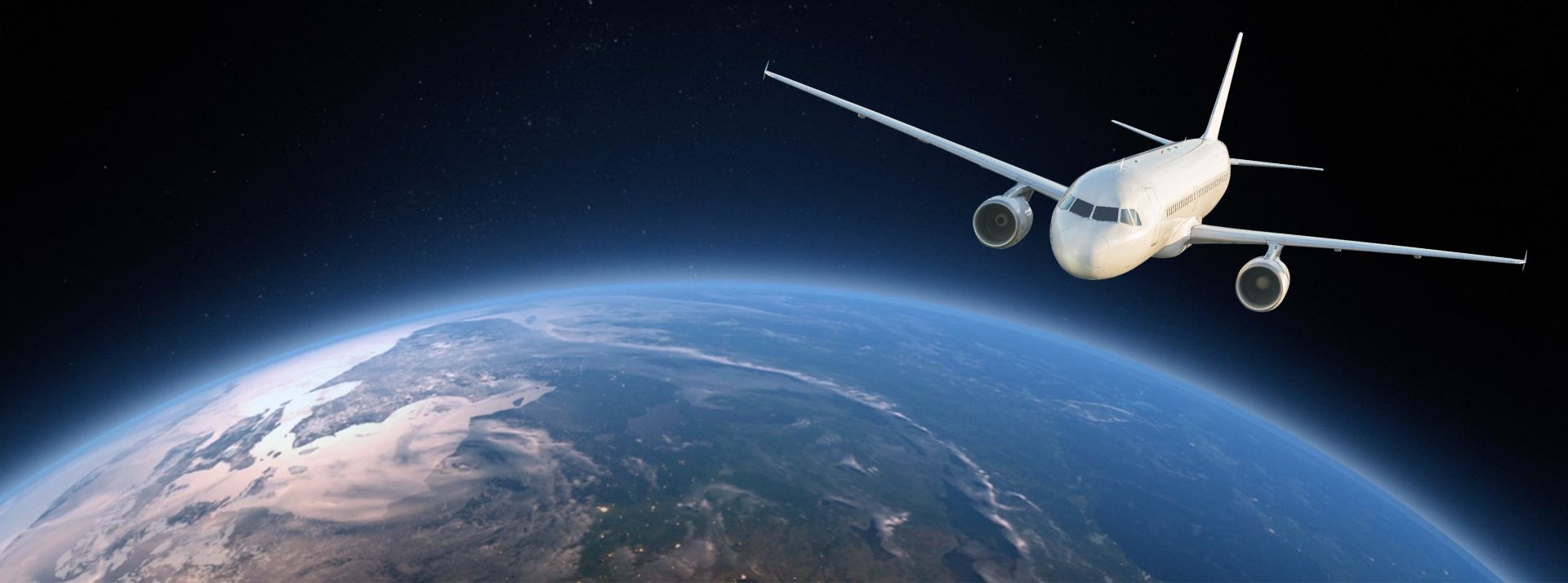 White passenger jet flying above Earth's curved horizon with a dark starry background.